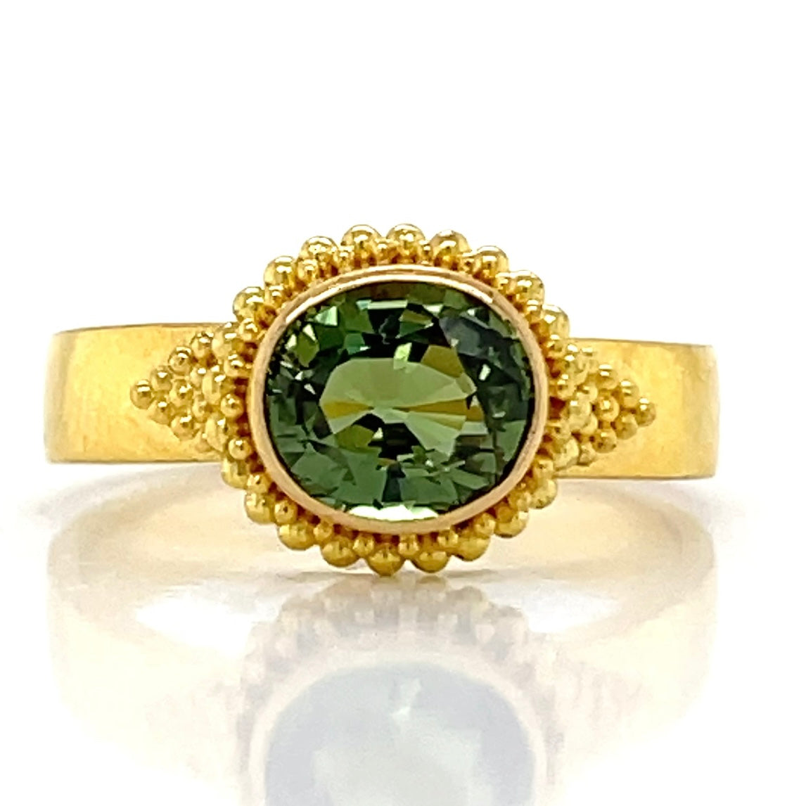 Green oval sapphire ring