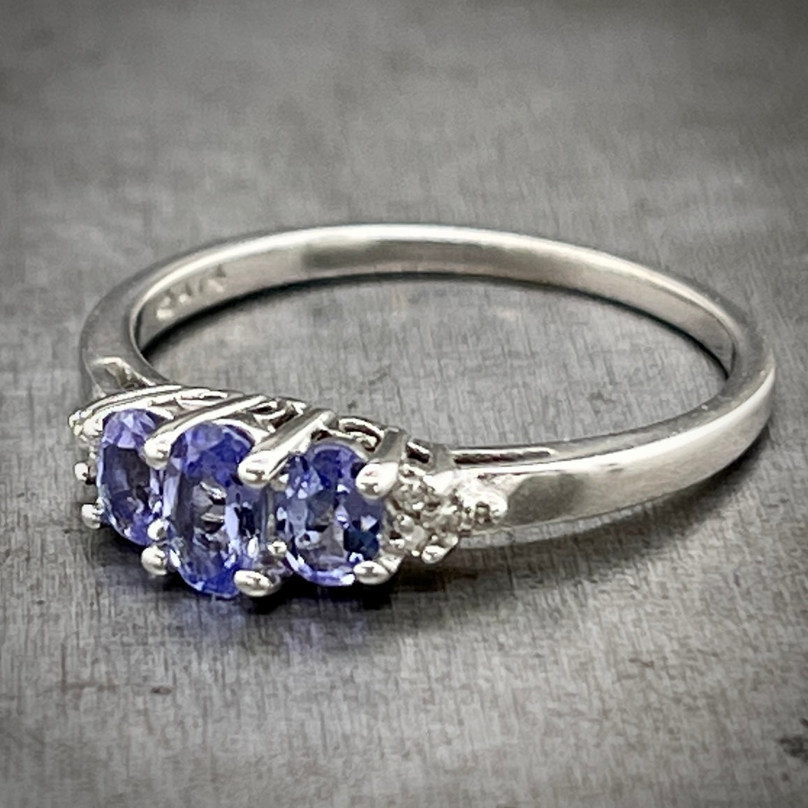 3/4 profile view of white gold tanzanite ring.
