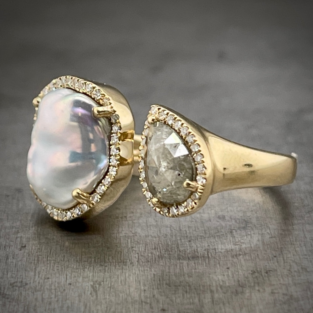 Angled View of Yellow Gold Pearl and Diamond Negative Space Ring.