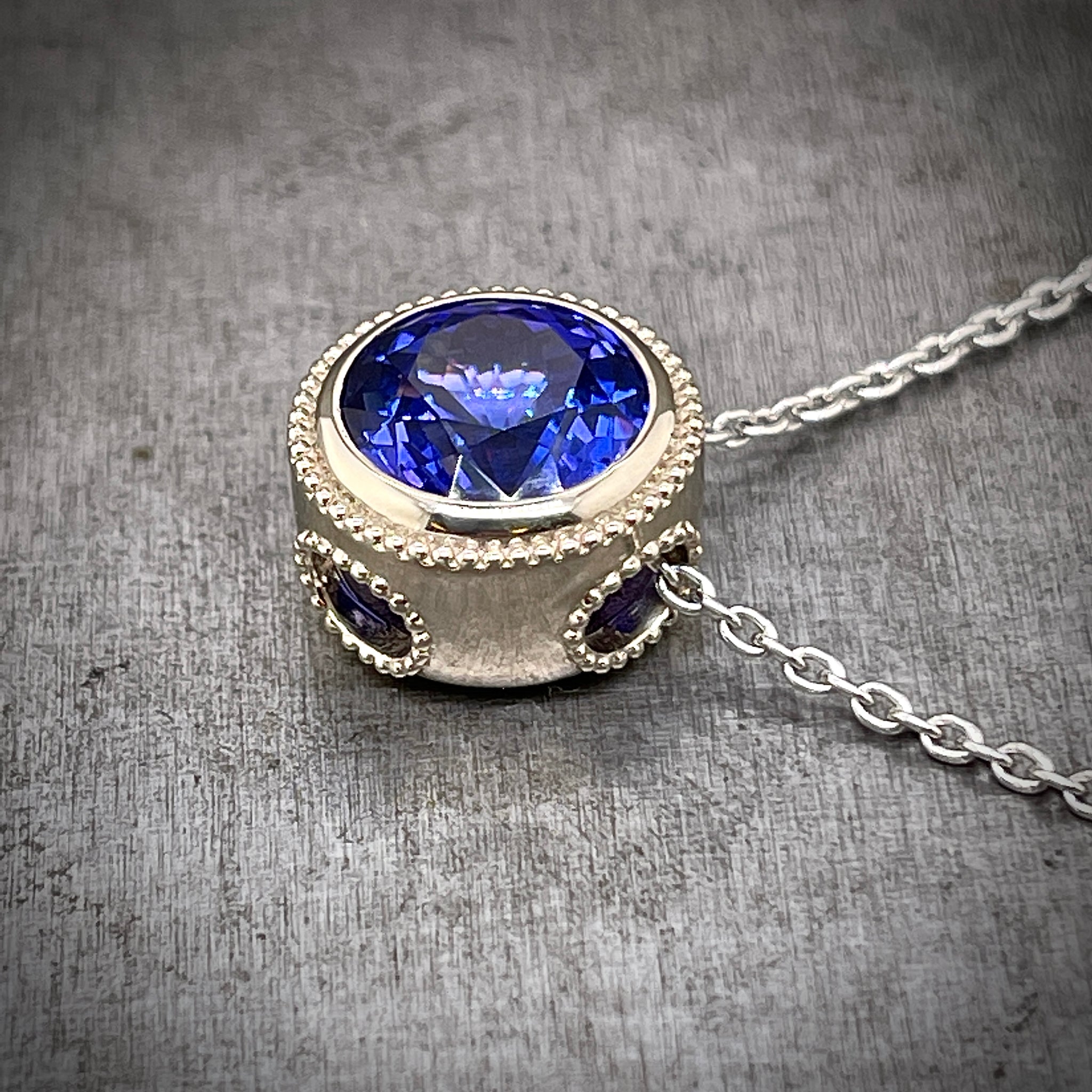 Side View 14K White Gold Tanzanite Necklace, Showing Two Windows in the Bezel
