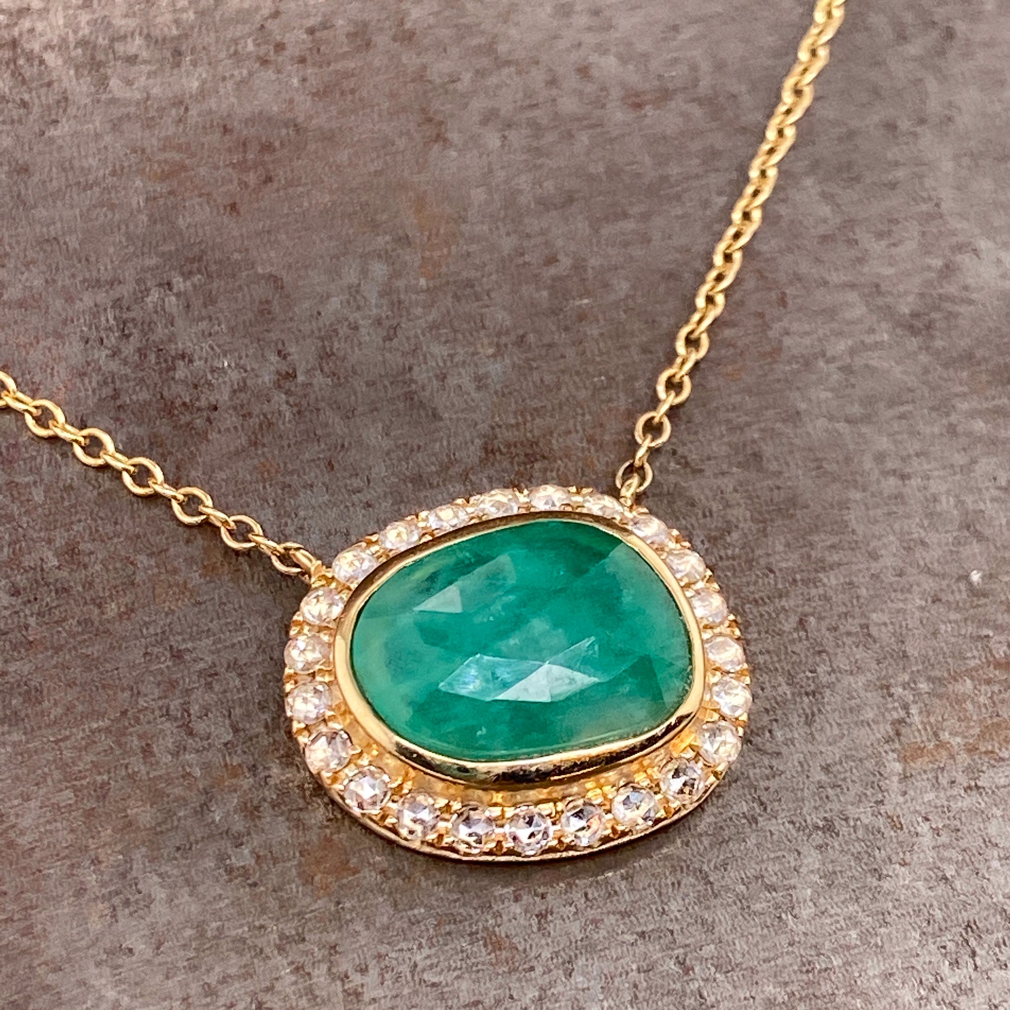 natural emerald pendant with diamond halo in 14k yellow gold necklace