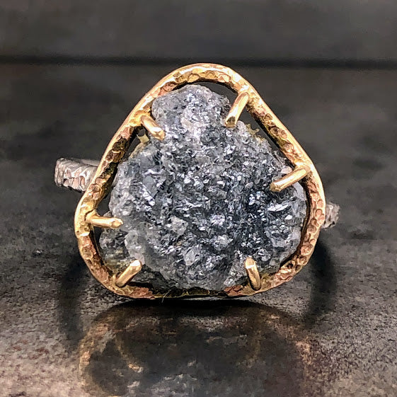 Frontal view of raw diamond 14 karat yellow gold and oxidized silver ring. Here you can better see the crystals on the face of the diamond.