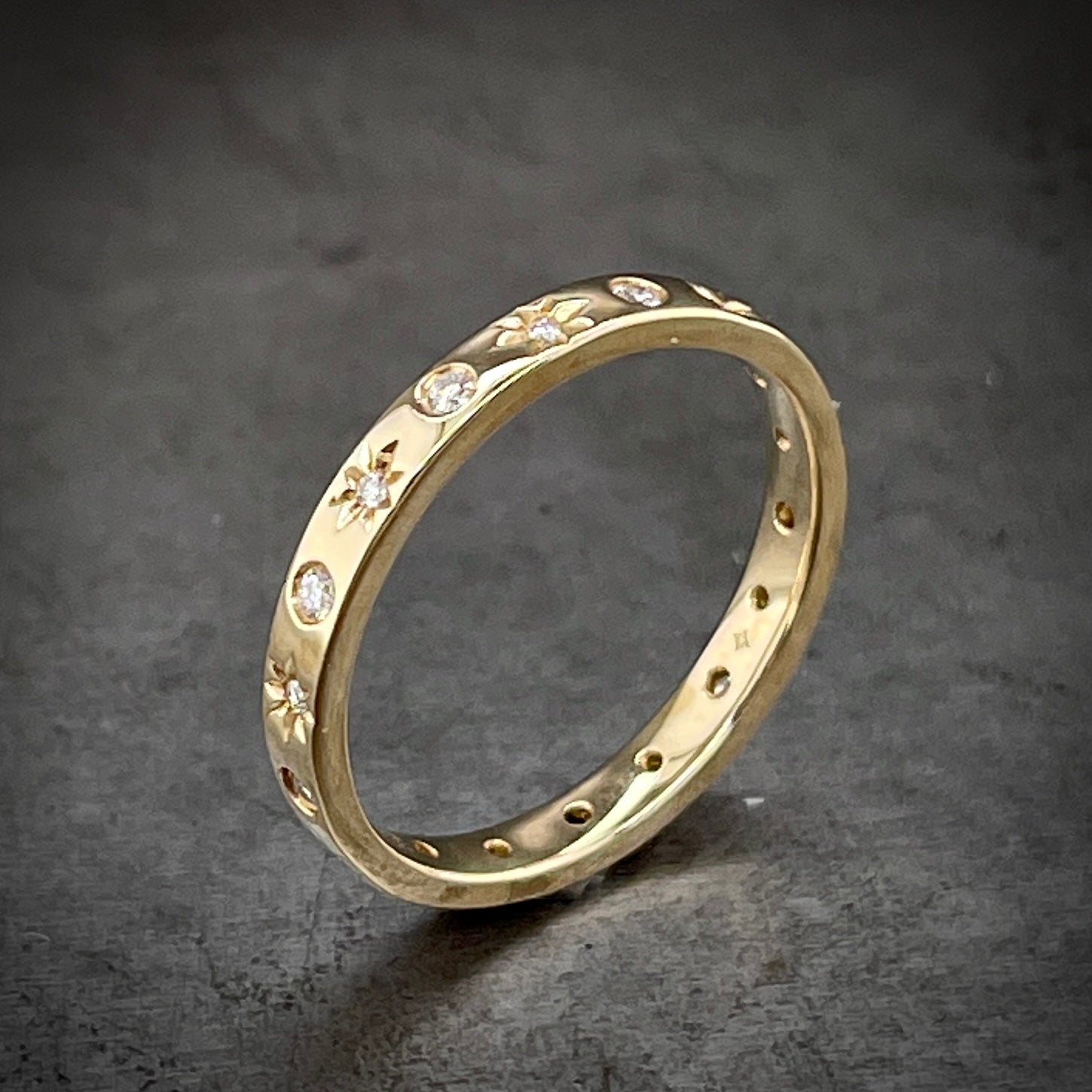 Angled aerial view of diamond star ring.