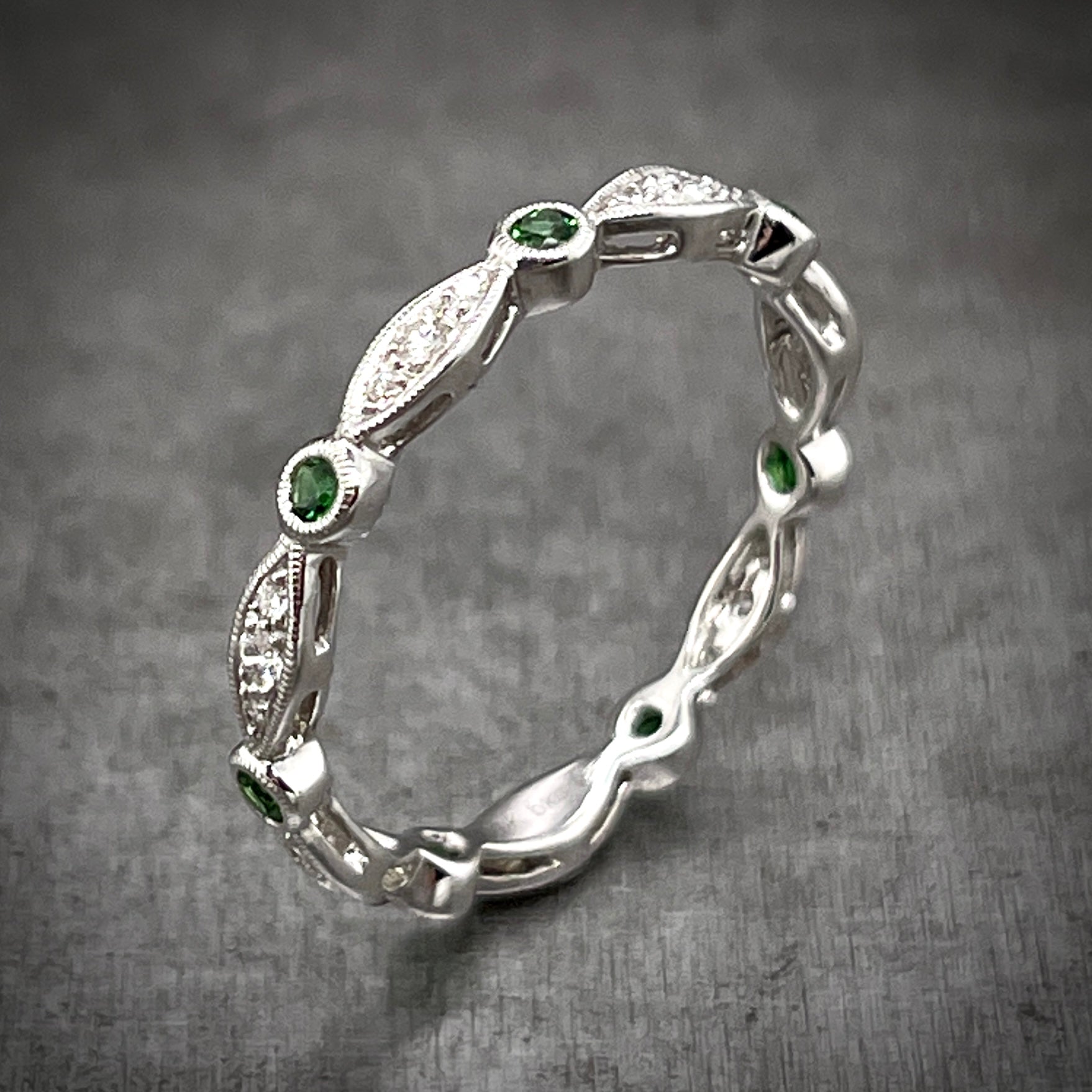 Angled aerial view of diamond and eternity band.