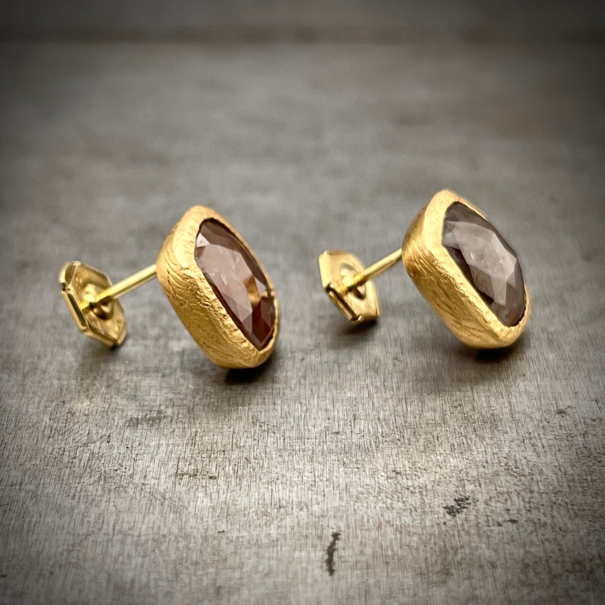 Side View of Rose Cut Red/Brown Diamond Earrings. Stud Earrings Feature Locking Backs.