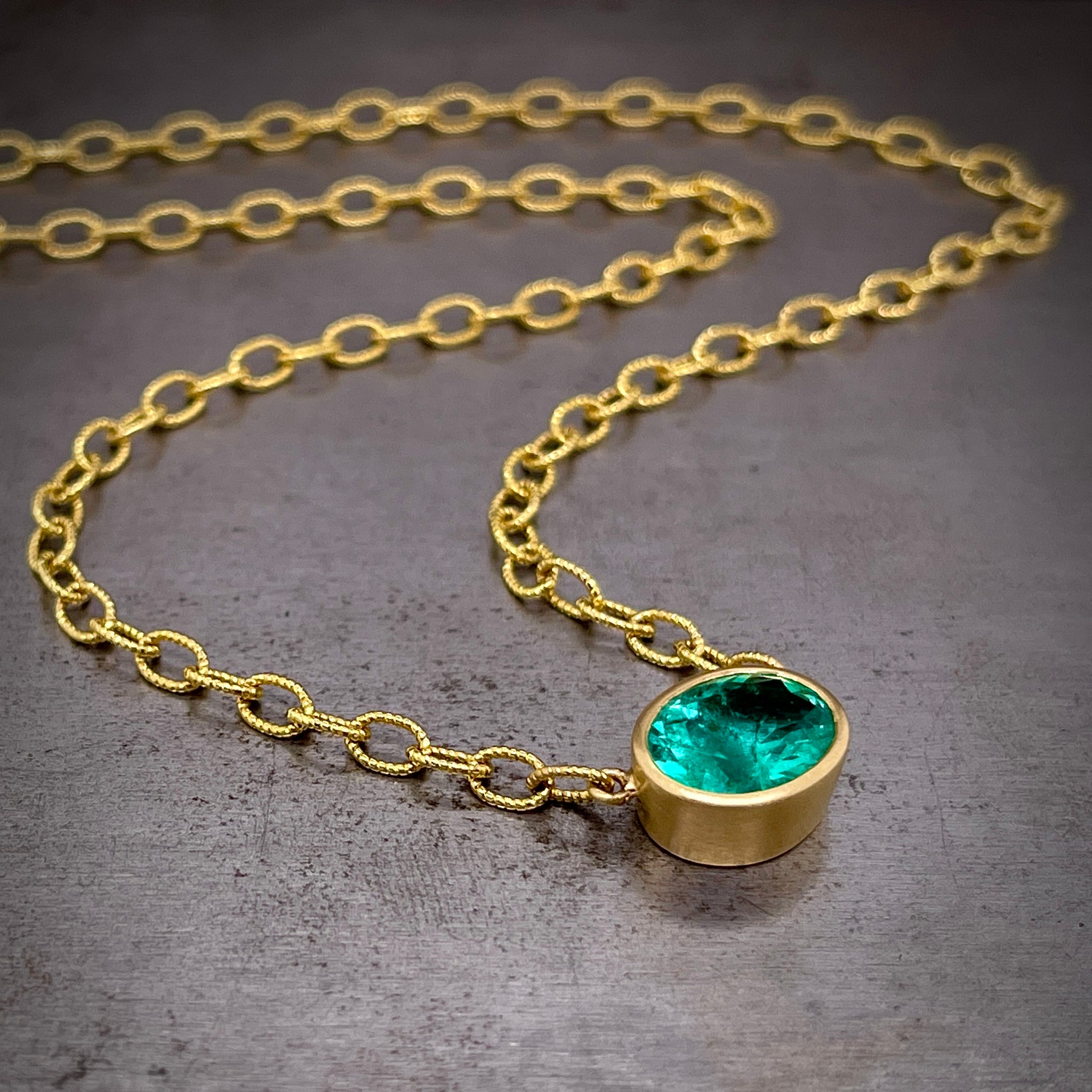 Full Angled View of 18k Yellow Gold Emerald Necklace