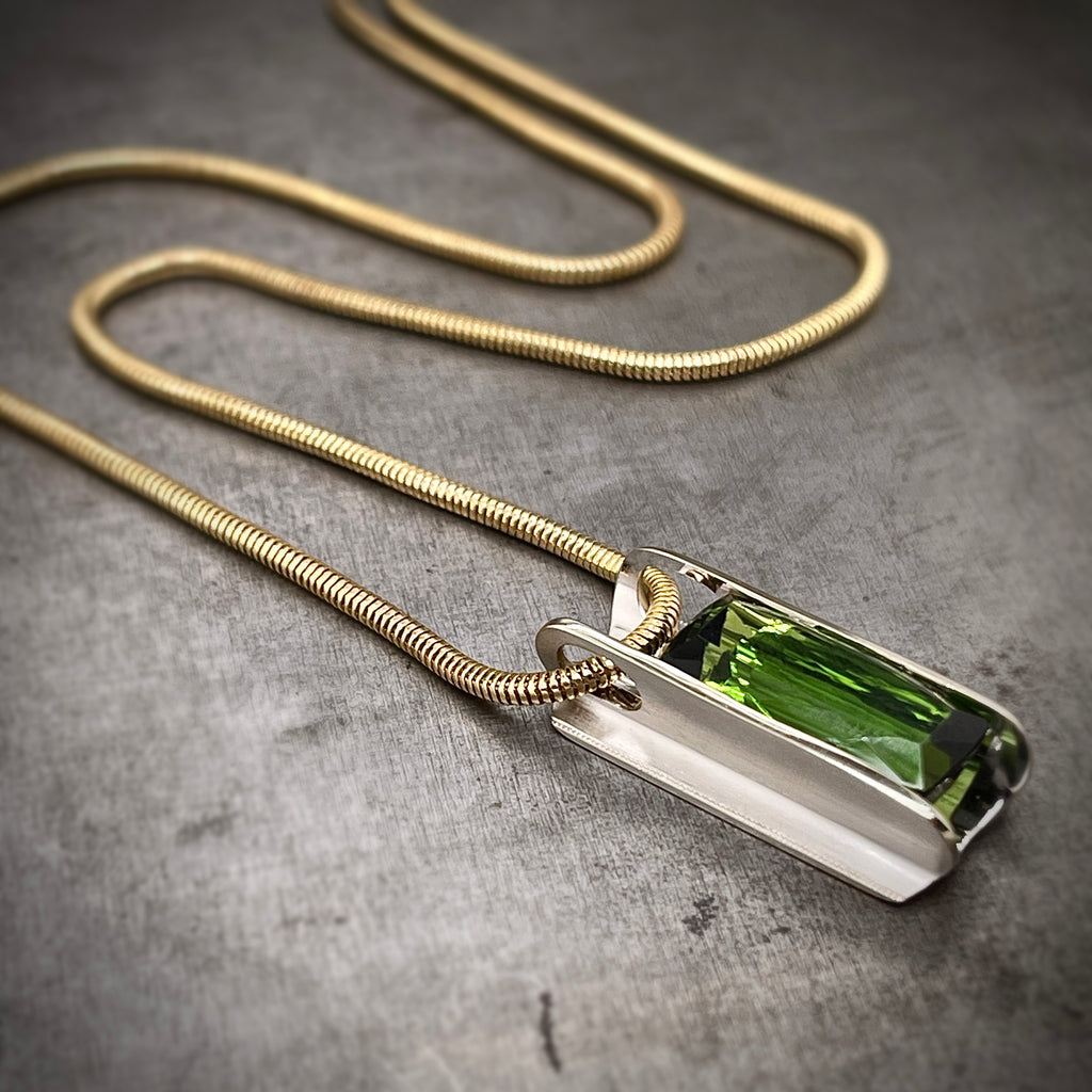 Angled View of 14k White Gold Green Tourmaline Pendant on Yellow Gold Chain