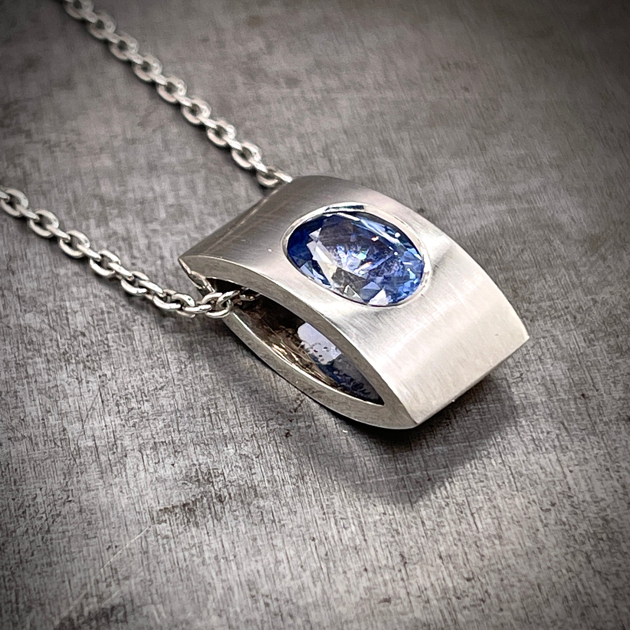 Side View of 18k White Gold Pale Blue Sapphire Necklace