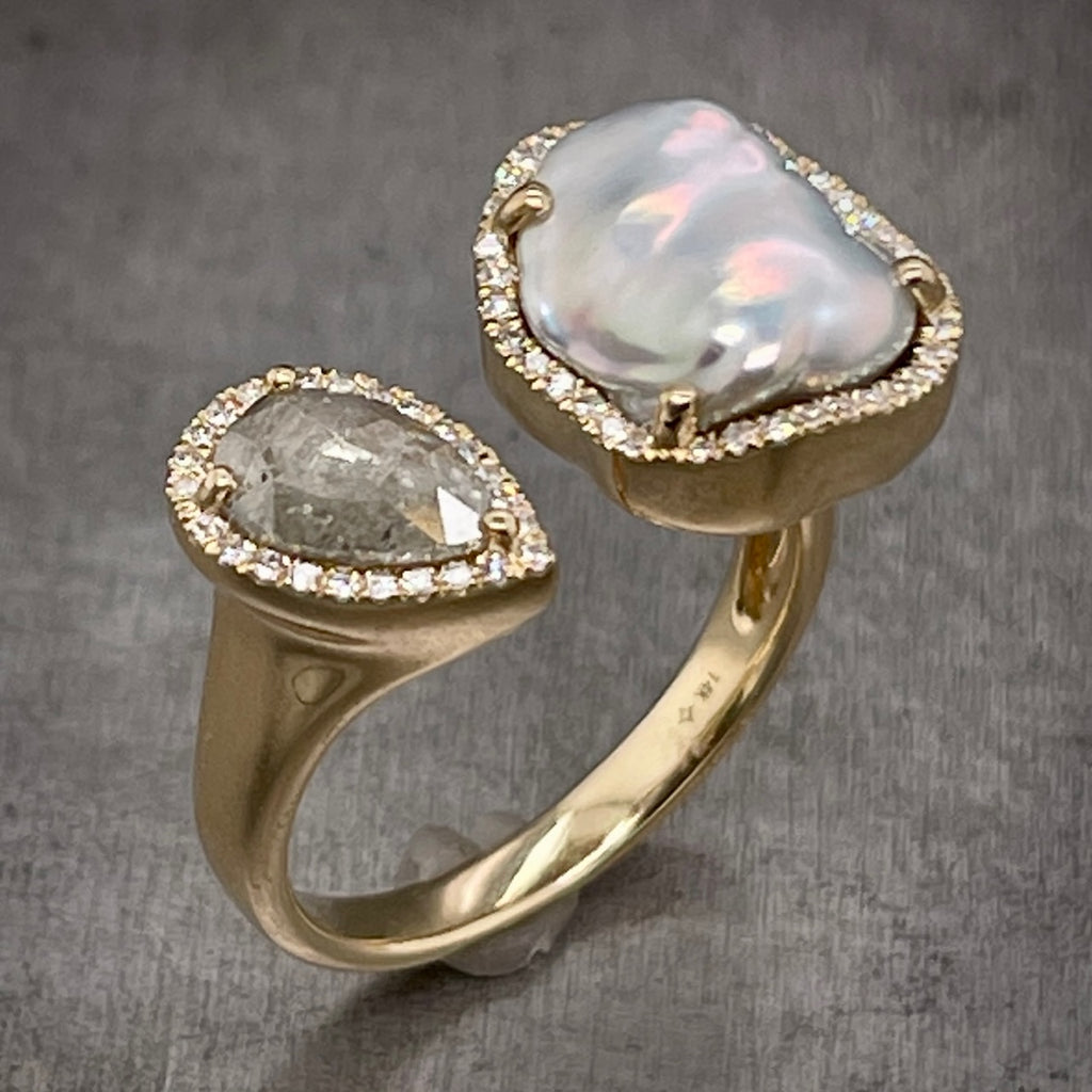 Angled View of Yellow Gold Pearl and Diamond Negative Space Ring, Illustrating Iridescence of the Pearl.
