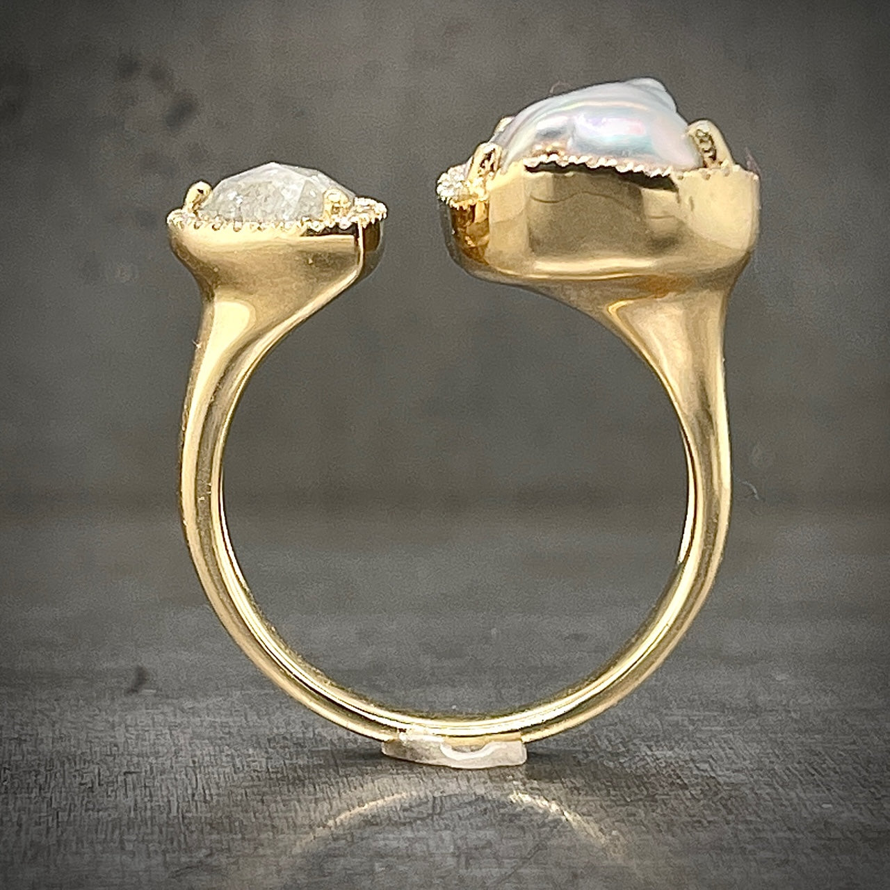 Side Profile of Yellow Gold Pearl and Diamond Negative Space Ring.
