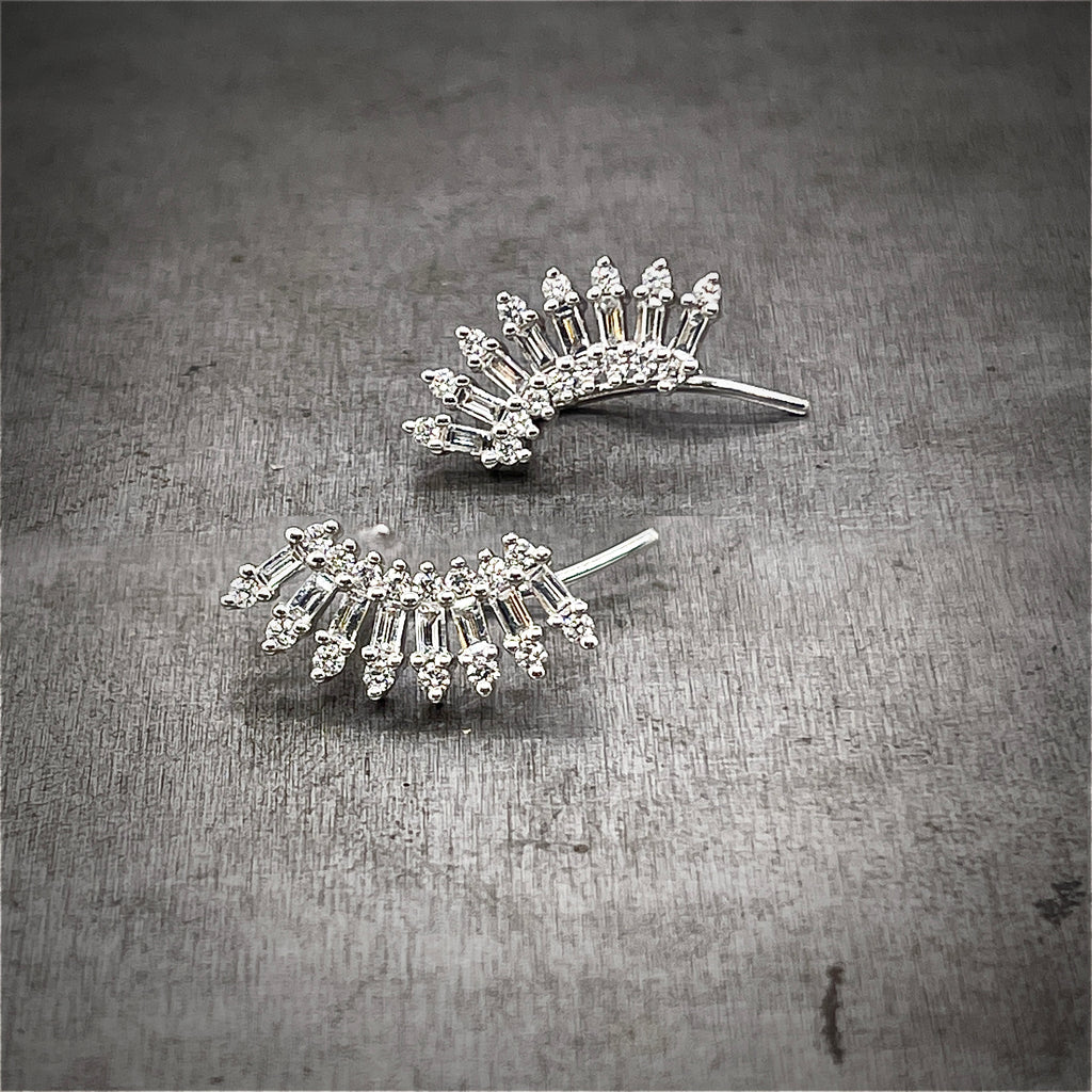 Front View of pair of diamond and 14k white gold climber earrings. These diamond earrings are designed to hug the earlobe. 