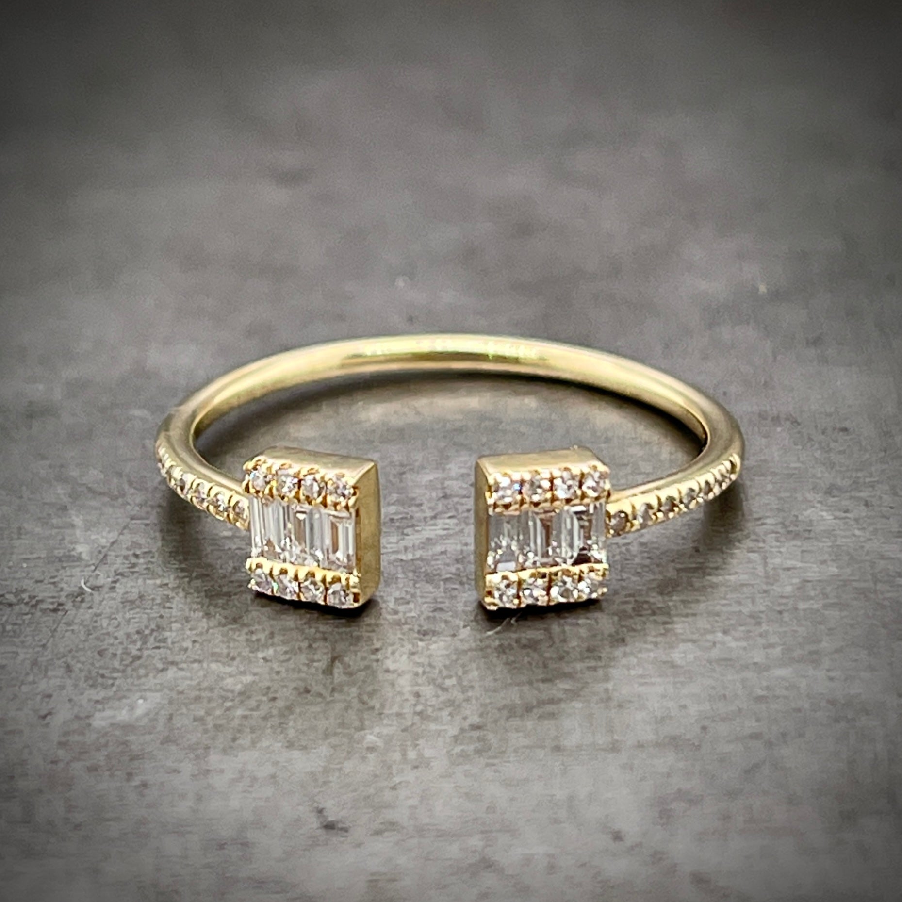 Full view of yellow gold negative space ring.