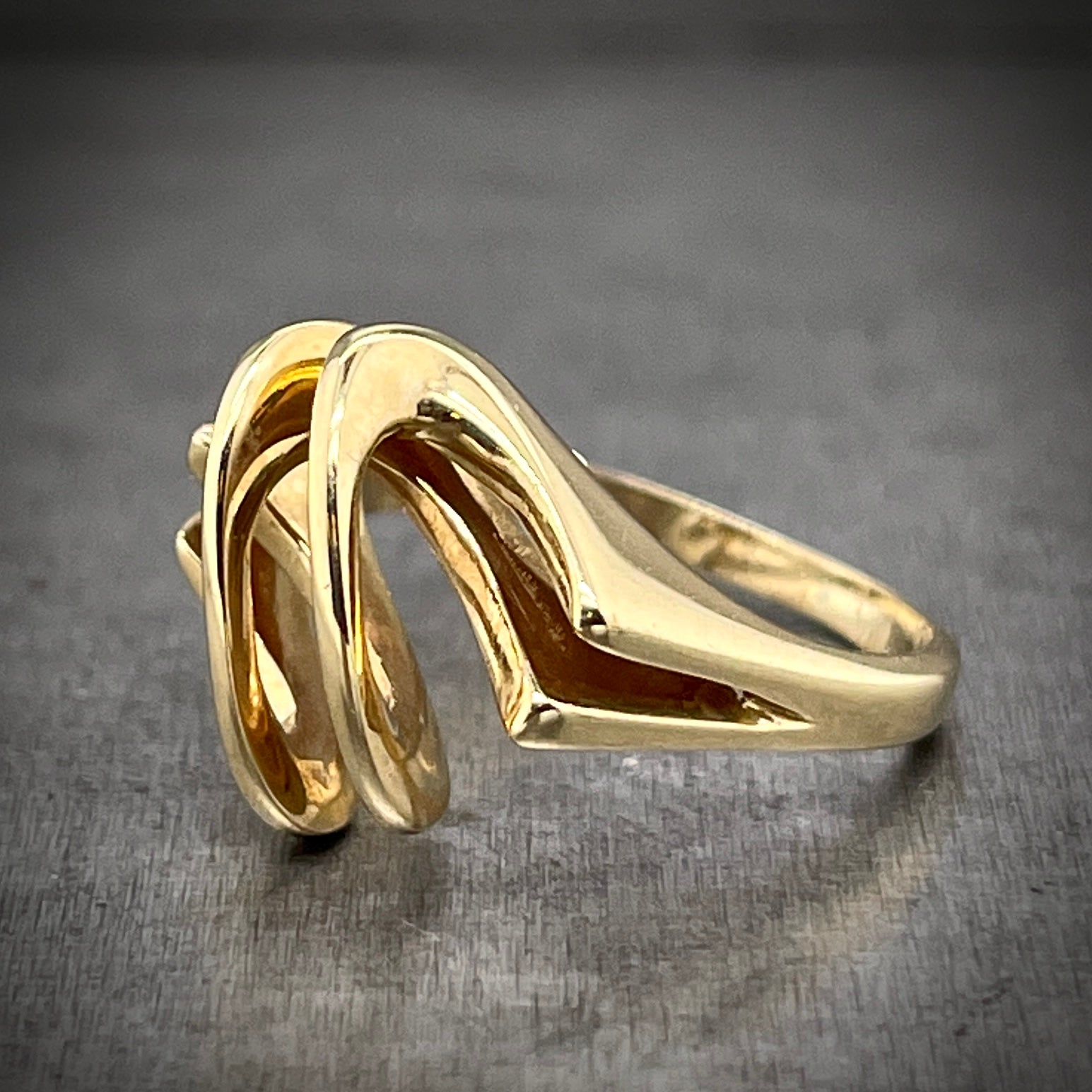 3/4 profile of folded gold ring. here you can see where the two wires meet on the shoulder of the ring and form into one shank.