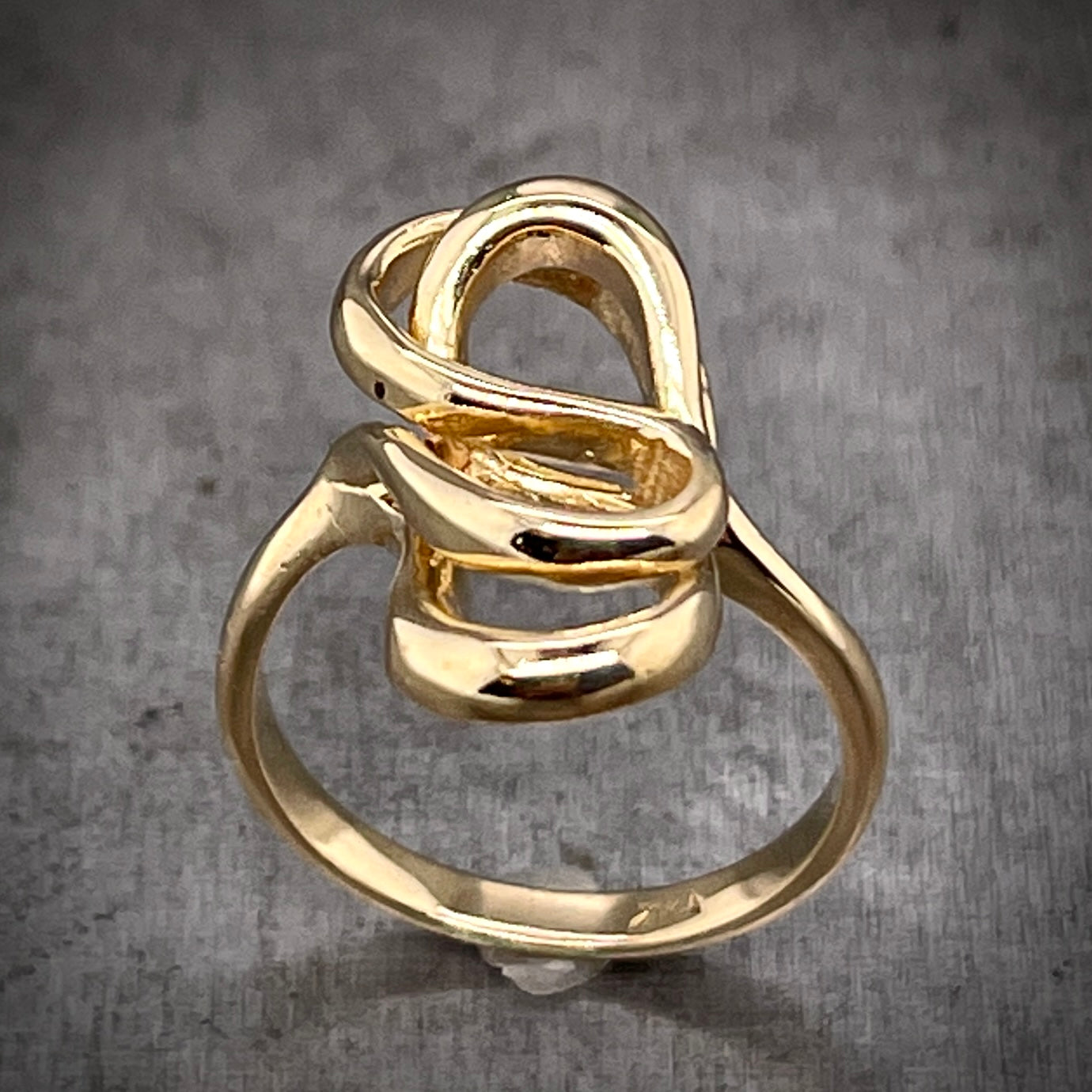 Angled aerial view of Abstract Gold Ring.