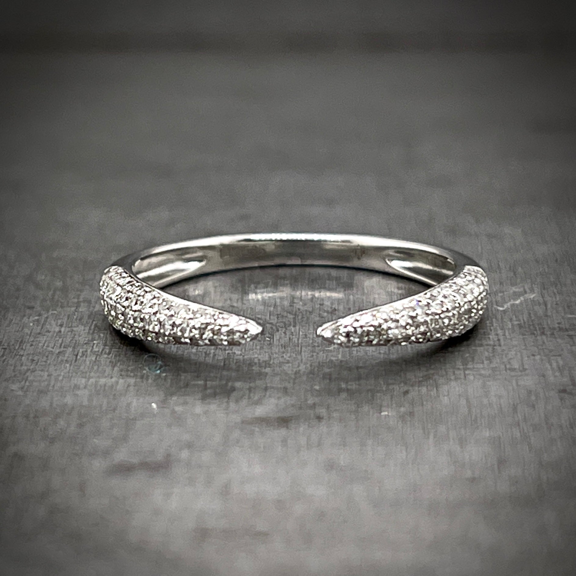 Frontal view of single diamond claw ring.