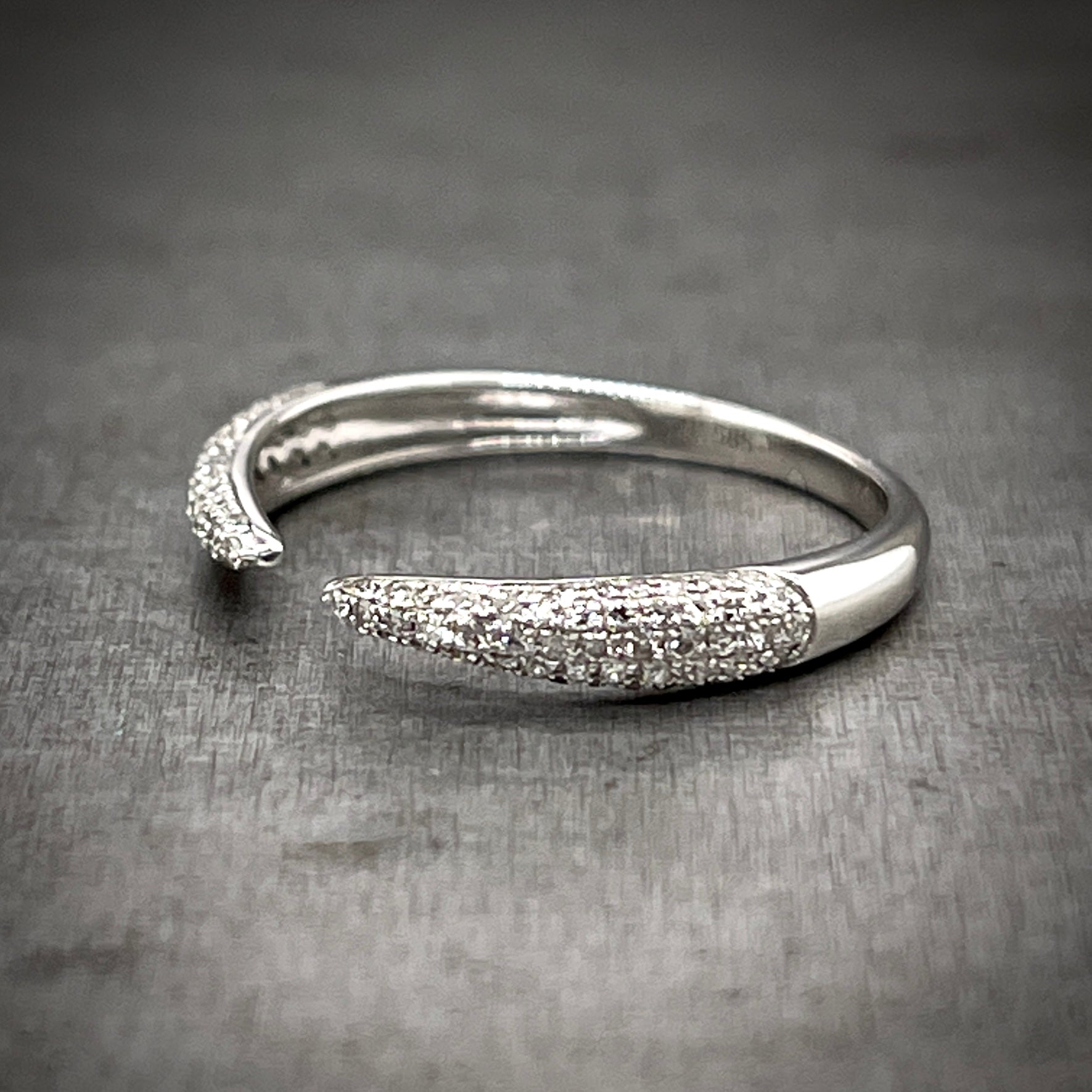 3/4 profile of single diamond claw ring.