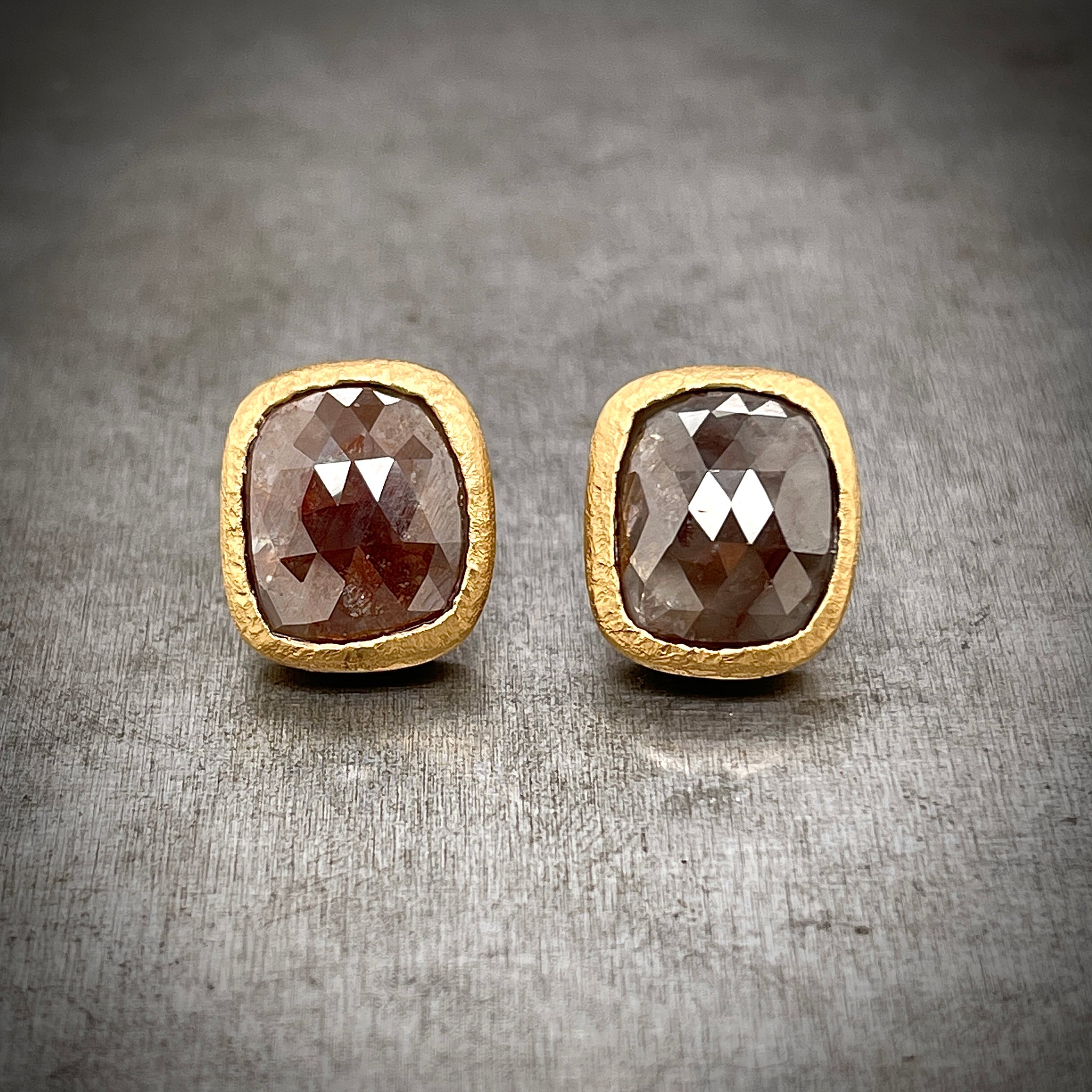 Front View of rose cut red/brown diamond stud earrings.