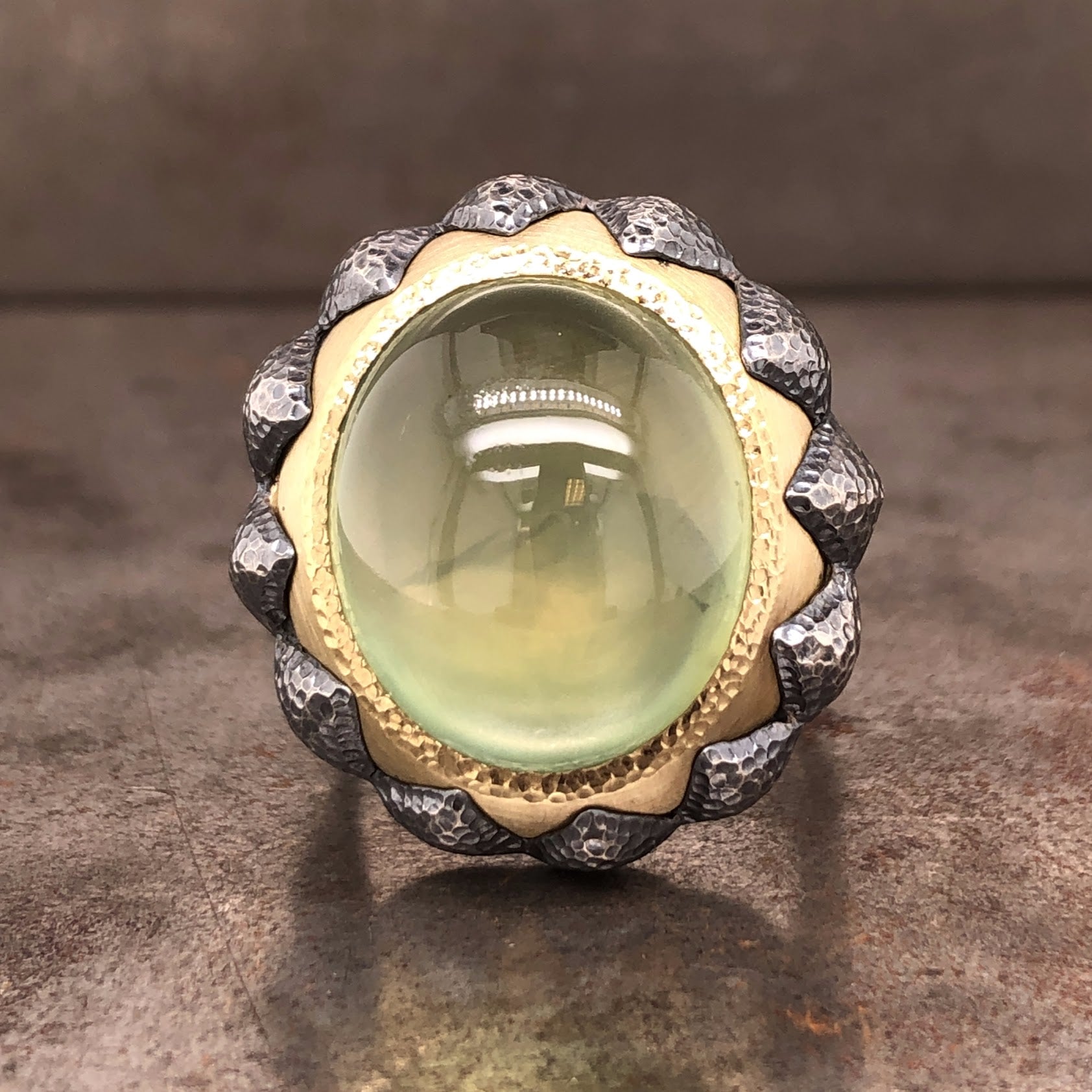 Frontal view of prehnite gold and oxidized sterling silver ring.